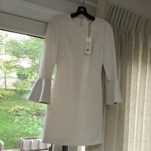 Ivory/White tailored feminine dress with bell sleeves. With original tags.